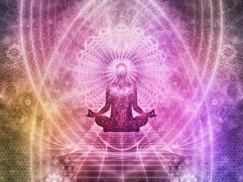 Psychedelic pink & purple image showing someone practicing yoga and mindfulness.